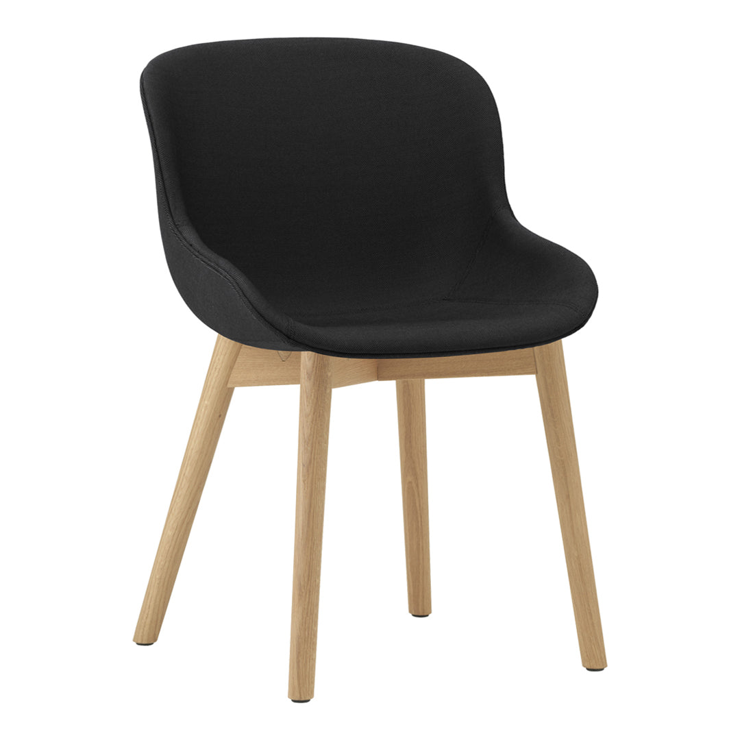 Black upholstered chair with smooth curves and natural wood legs, complementing modern decor.