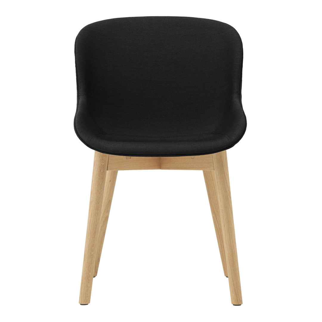 Black upholstered chair with smooth curves and natural wood legs, perfect for modern decor. Minimalist design.