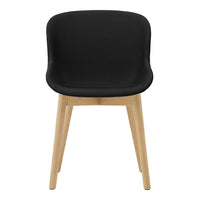 Black upholstered chair with smooth curves and natural wood legs, perfect for modern decor. Minimalist design.