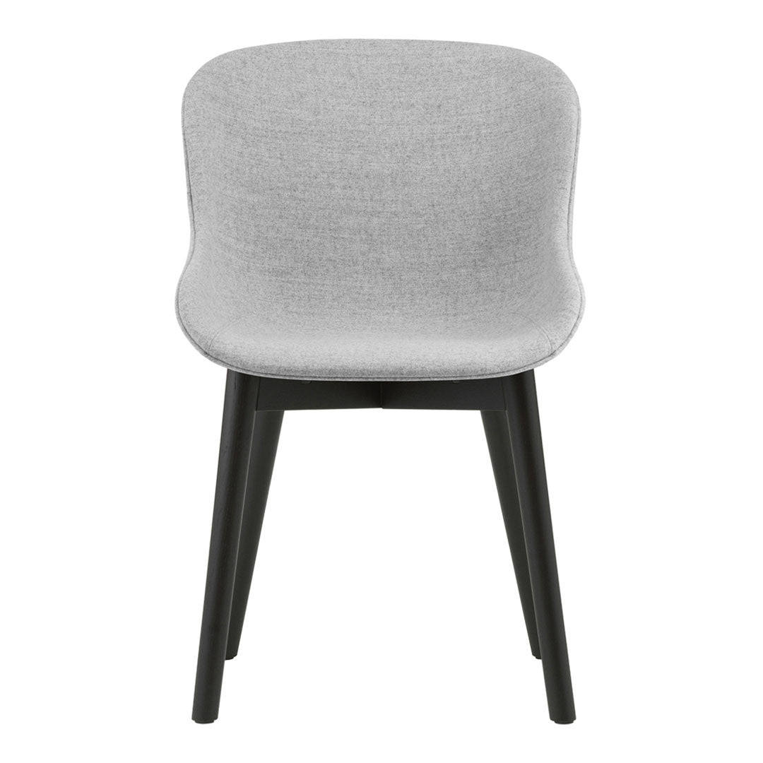 Light gray upholstered chair with a smooth finish and black wooden legs, featuring a modern, minimalist design.