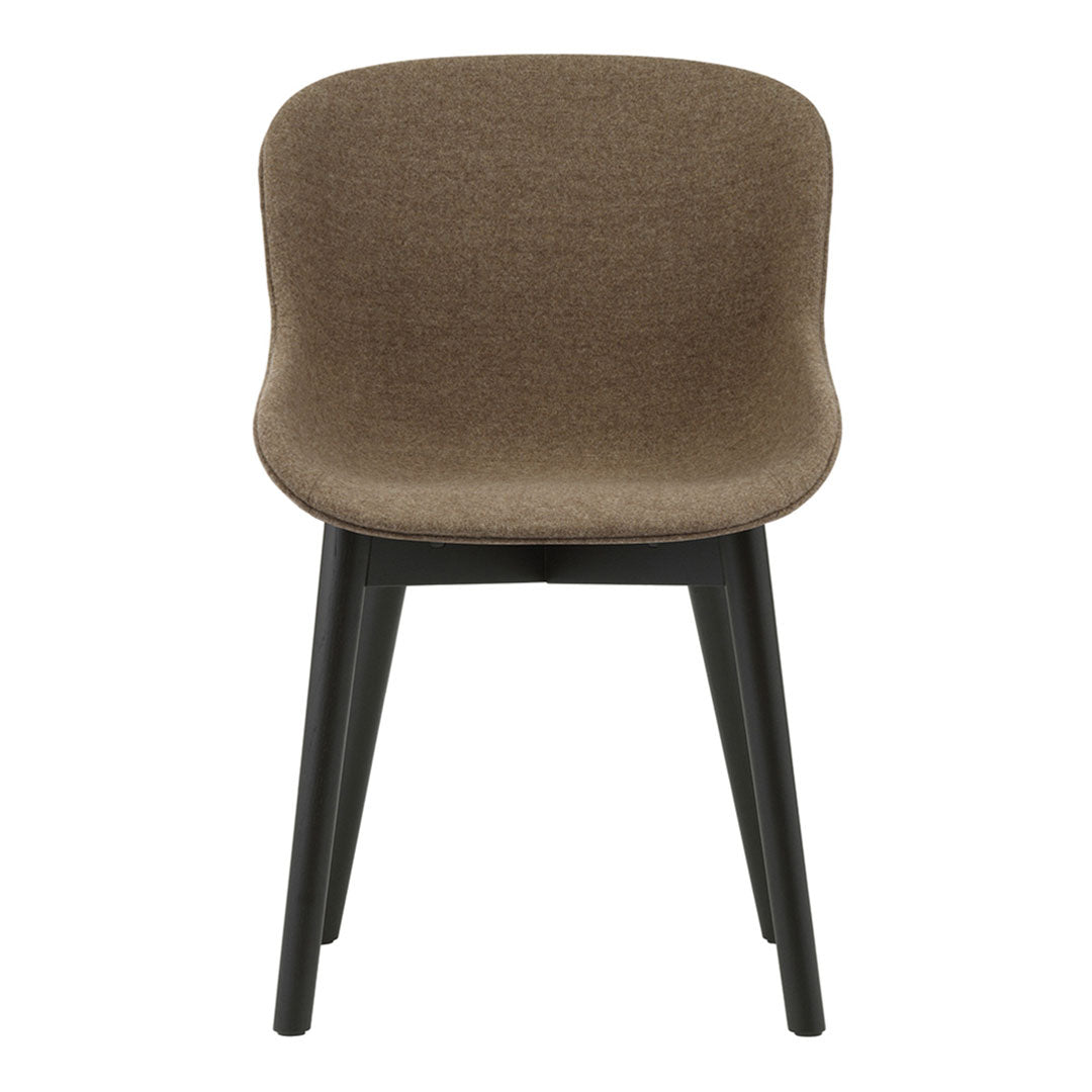 Brown upholstered chair with a smooth, curved backrest and black wooden legs. Modern, minimalist design.