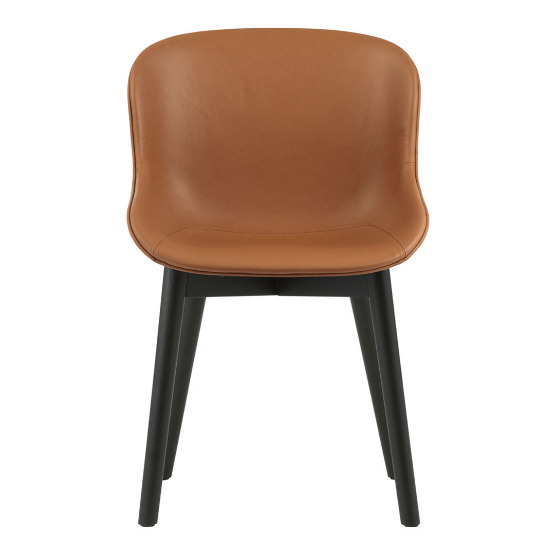 Brown leather chair with a smooth finish and black wooden legs, featuring a minimalist design.