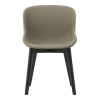 Modern chair in soft taupe upholstery with sleek black legs, showcasing a minimalist design and smooth curves.