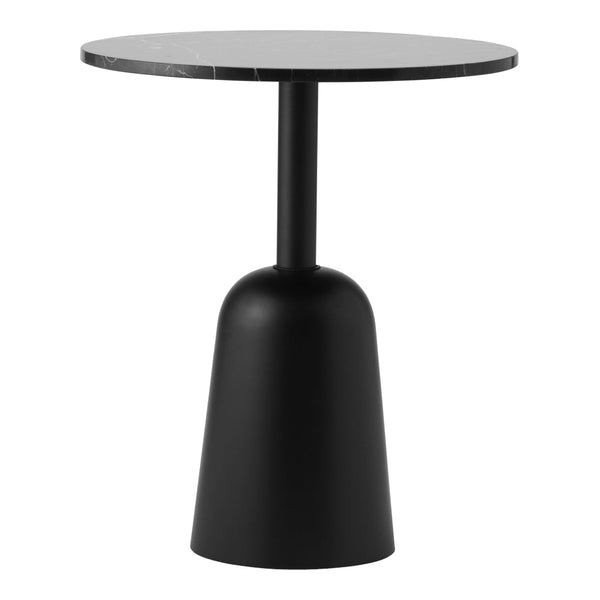 "Round black table with a smooth, solid top and a sleek, curved base, featuring a minimalist design."