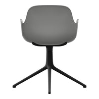 Gray molded chair with a sleek black base and minimalist design. Ideal for modern decor.