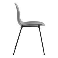 Gray molded plastic chair with sleek black metal legs, showcasing minimalist design and modern aesthetic.