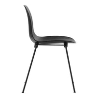 Black modern chair with a smooth curved seat and sleek black legs, featuring a minimalist design.