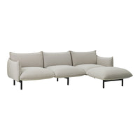 Beige sectional sofa with smooth, modern upholstery and minimalist black metal legs, featuring a sleek, contemporary design.