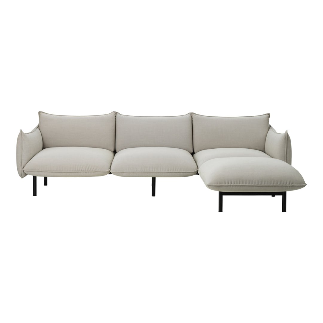 Beige sectional sofa with a smooth fabric texture and clean, minimalist design; perfect for modern living spaces.