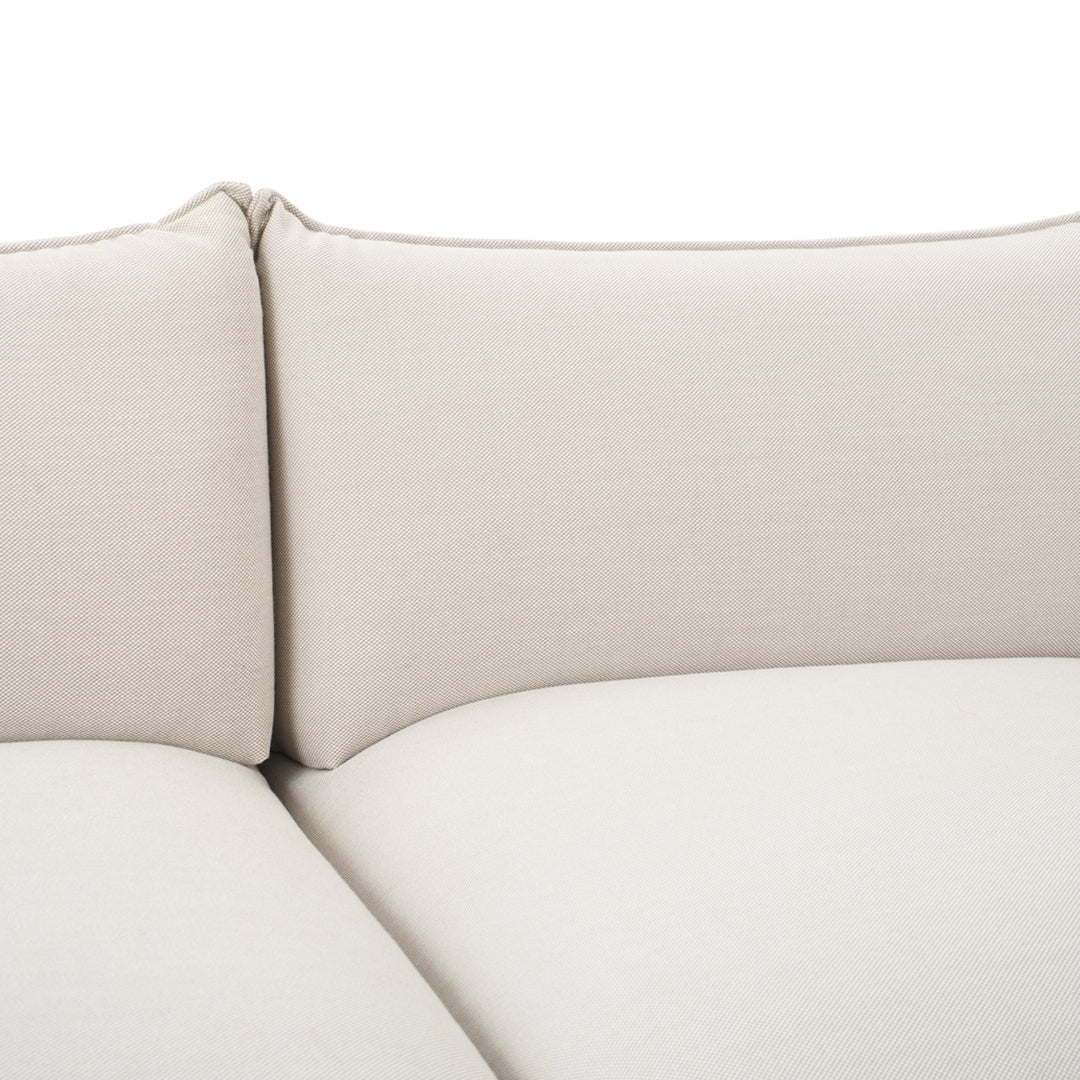 Light beige fabric upholstery with a smooth, minimalist pattern and clean lines. Perfect for modern interiors.