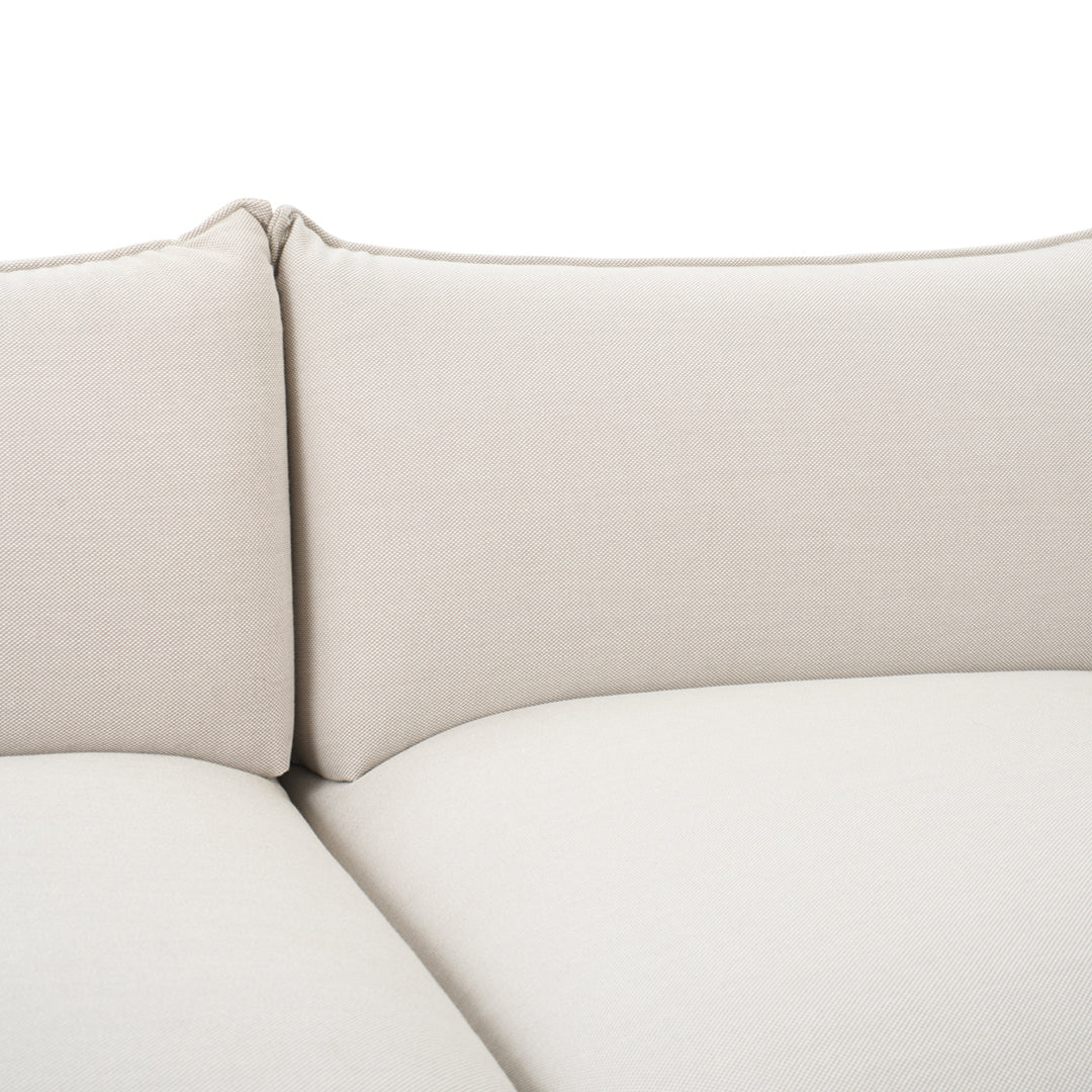 Light beige couch cushions with a smooth, textured fabric pattern, ideal for modern decor.