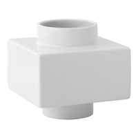 White ceramic vase with a sleek square base and cylindrical opening, offering a modern minimalist design.