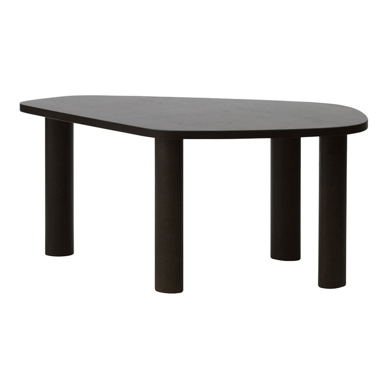 Minimalist black dining table with a unique organic shape and sturdy cylindrical legs, perfect for modern decor.