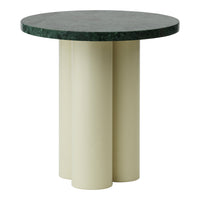 Round table featuring a dark green marble top and cream-colored cylindrical legs, showcasing a modern, minimalist design.
