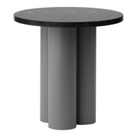 Round black tabletop with grey cylindrical base, featuring a minimalist design and smooth finish. Perfect for modern decor.