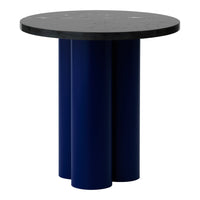 Round black tabletop with three sleek navy-blue cylindrical legs. Modern design with bold color contrast.
