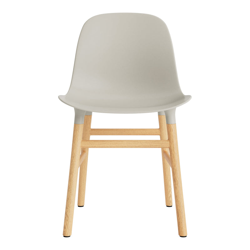 Light gray plastic chair with natural wood legs, minimalistic design, and smooth, clean lines. Ideal for modern decor.