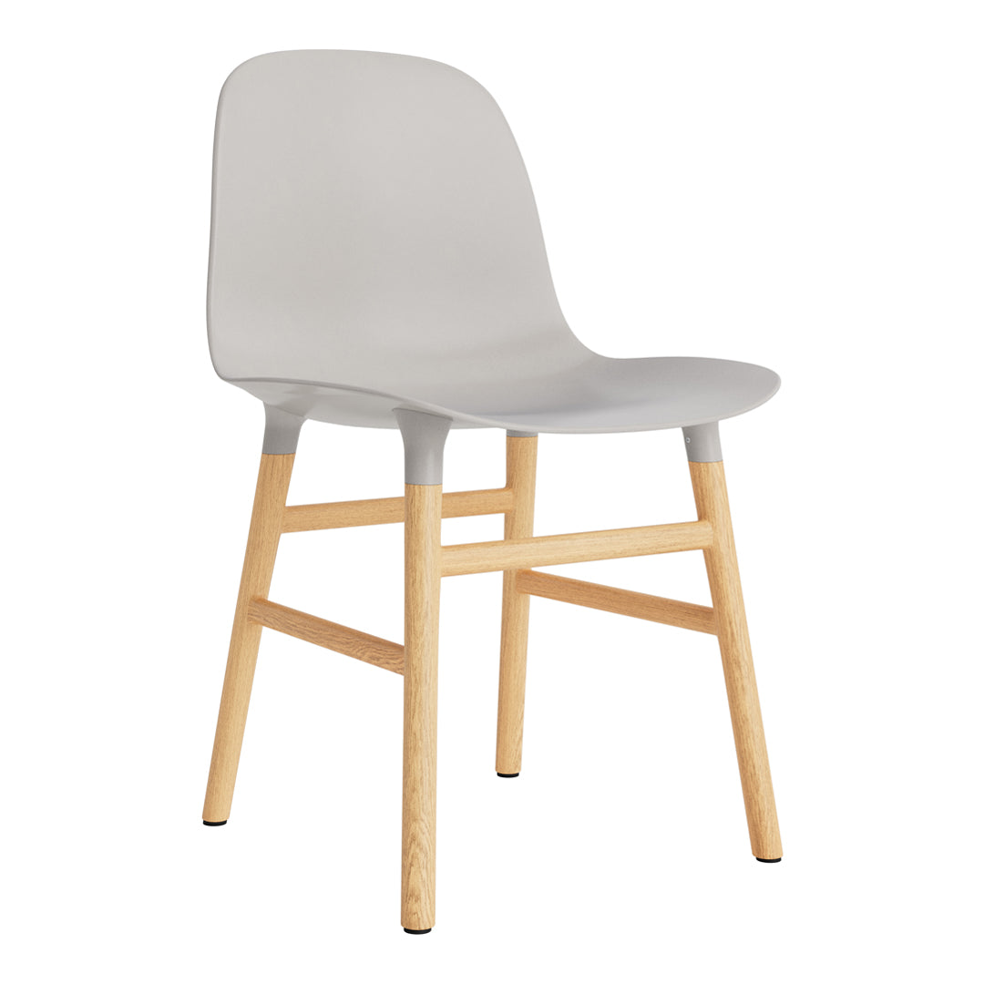 Gray molded plastic chair with natural wood legs, featuring a minimalist design and smooth finish.