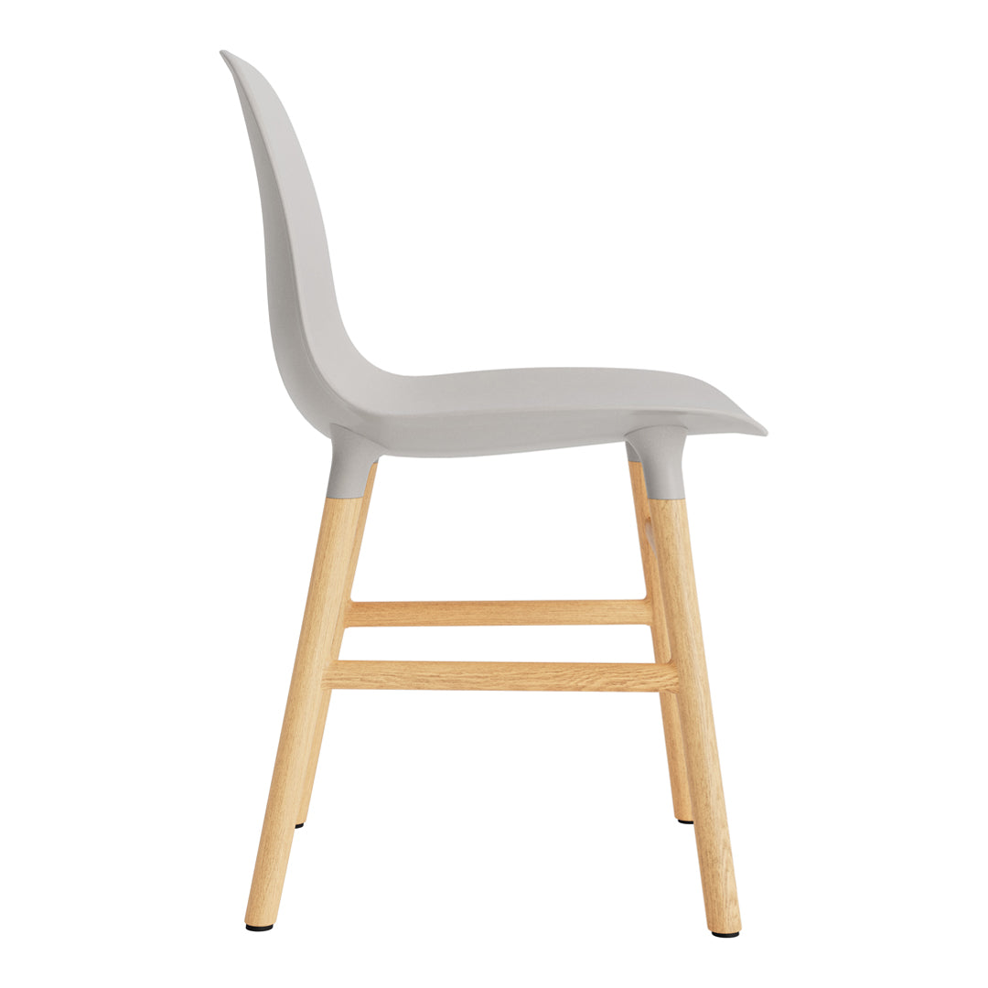 Gray chair with sleek design and natural wood legs, featuring a smooth, minimalist aesthetic.
