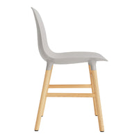 Gray chair with sleek design and natural wood legs, featuring a smooth, minimalist aesthetic.