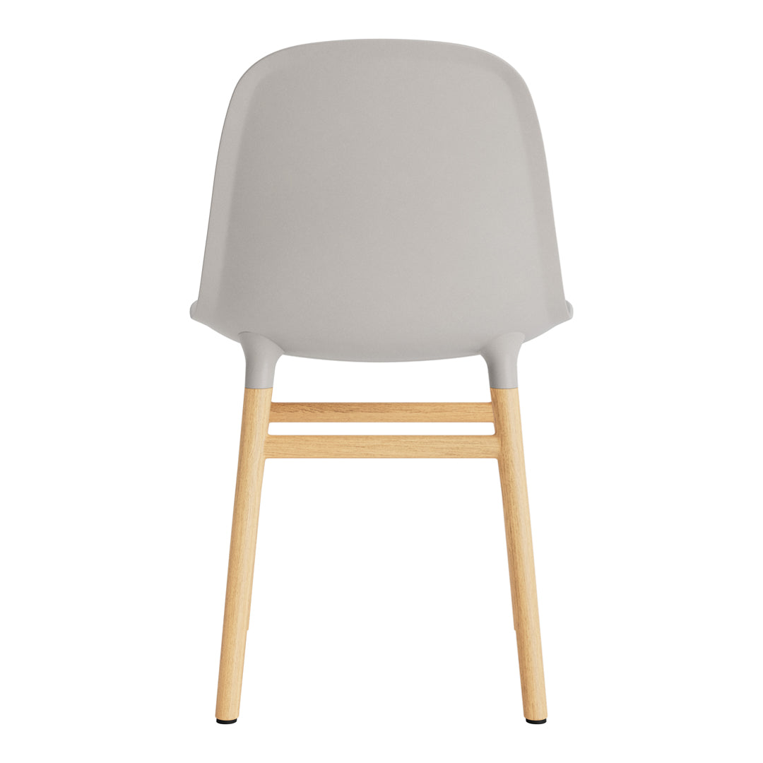 Gray chair with a smooth, curved back and natural wood legs, showcasing a minimalist design.