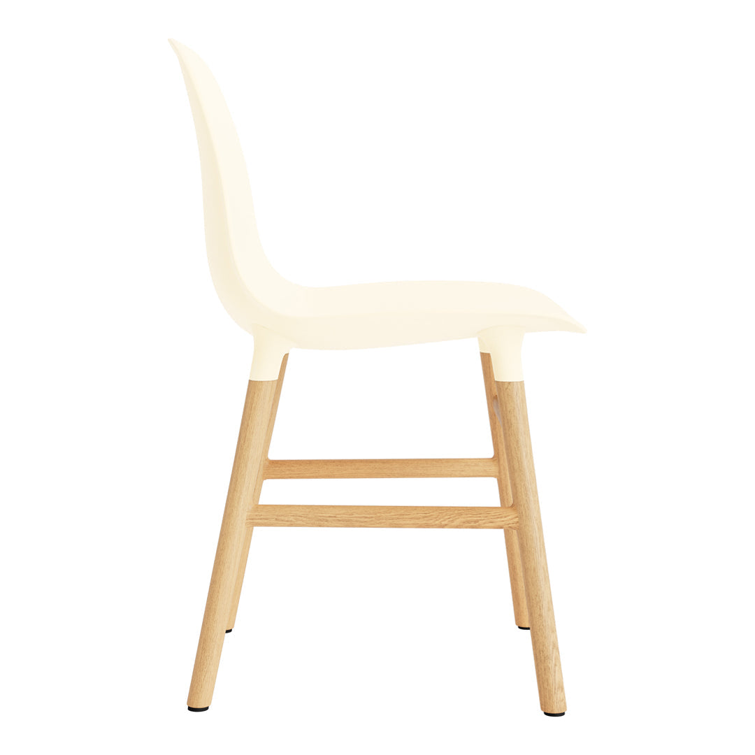 Minimalist white chair with wooden legs, featuring a sleek design and smooth surface. Perfect for modern decor.