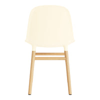 Cream chair with a smooth finish and natural wood legs, showcasing a minimalist design and elegant simplicity.
