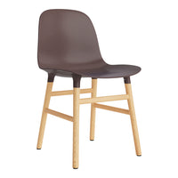 Brown molded chair with a smooth finish and natural wood legs, featuring a minimalist design for modern decor.