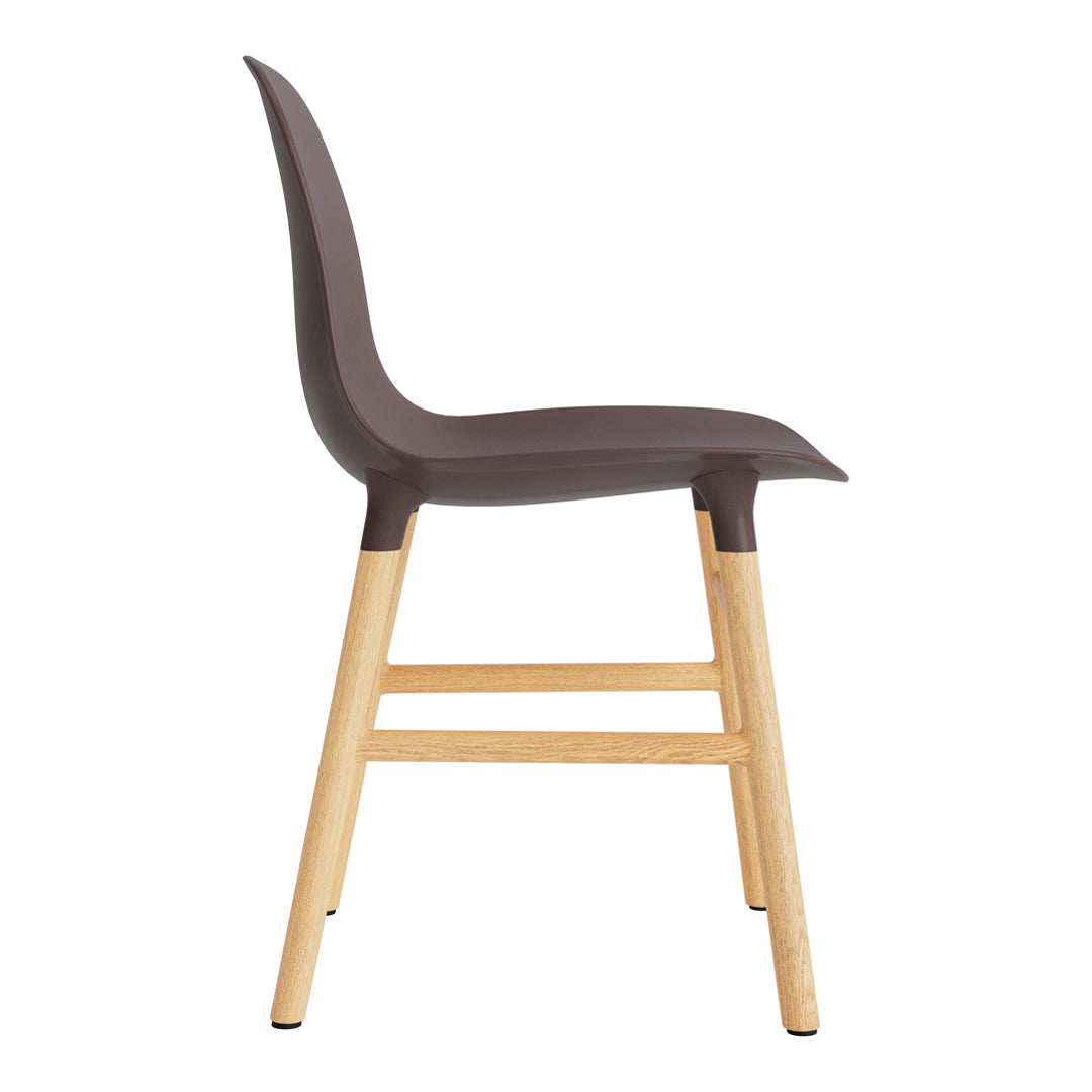 Brown molded plastic chair with light wood legs, featuring a sleek, minimalist design. Ideal for modern interiors.