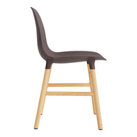 Brown molded plastic chair with light wood legs, featuring a sleek, minimalist design. Ideal for modern interiors.