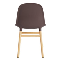 Brown plastic chair with natural wood legs, featuring a simple, modern design. Ideal for contemporary decor.