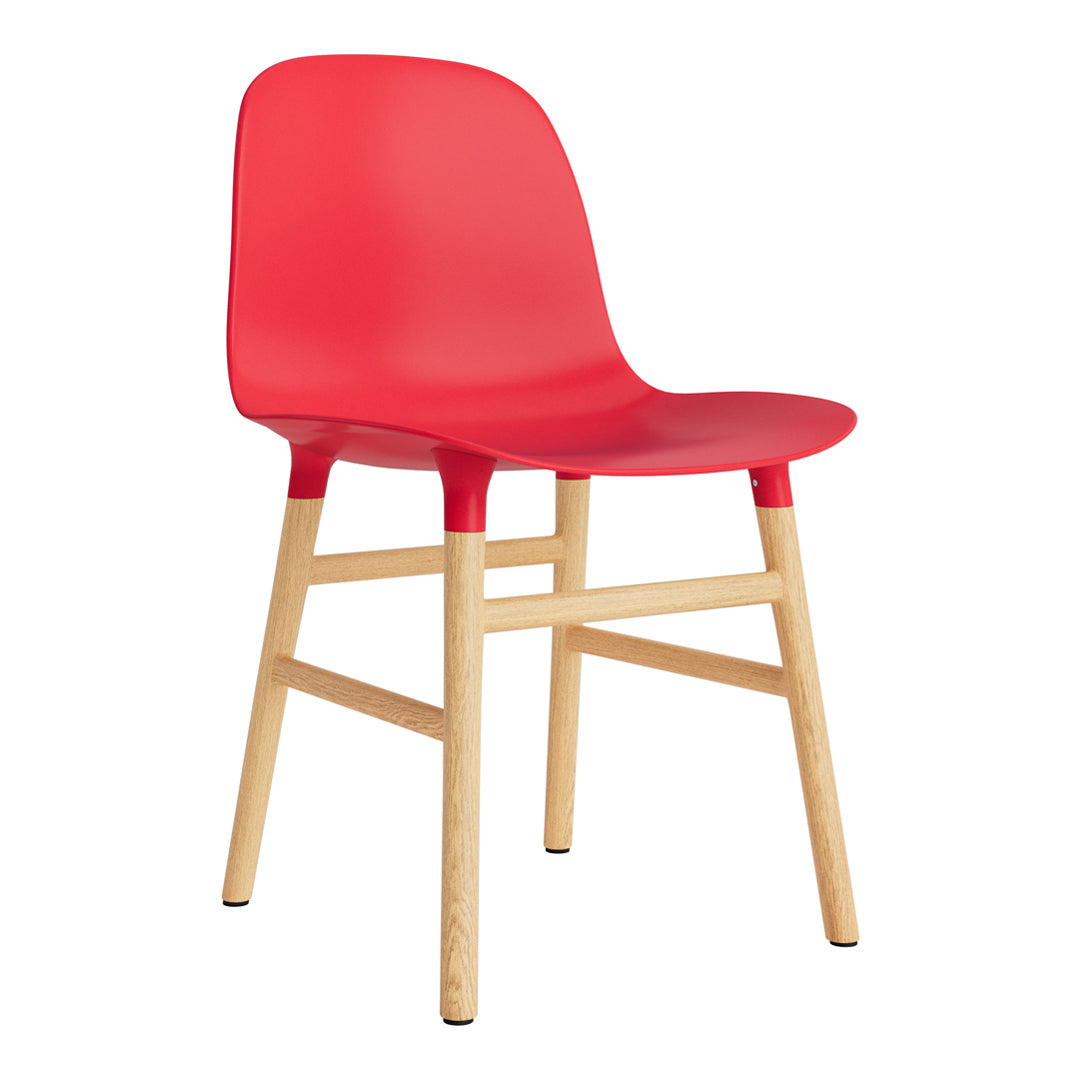 Red plastic dining chair with natural wood legs, featuring a sleek, modern design. Ideal for contemporary decor.