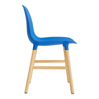 Blue plastic chair with a smooth finish and natural wood legs, featuring a minimalist design.