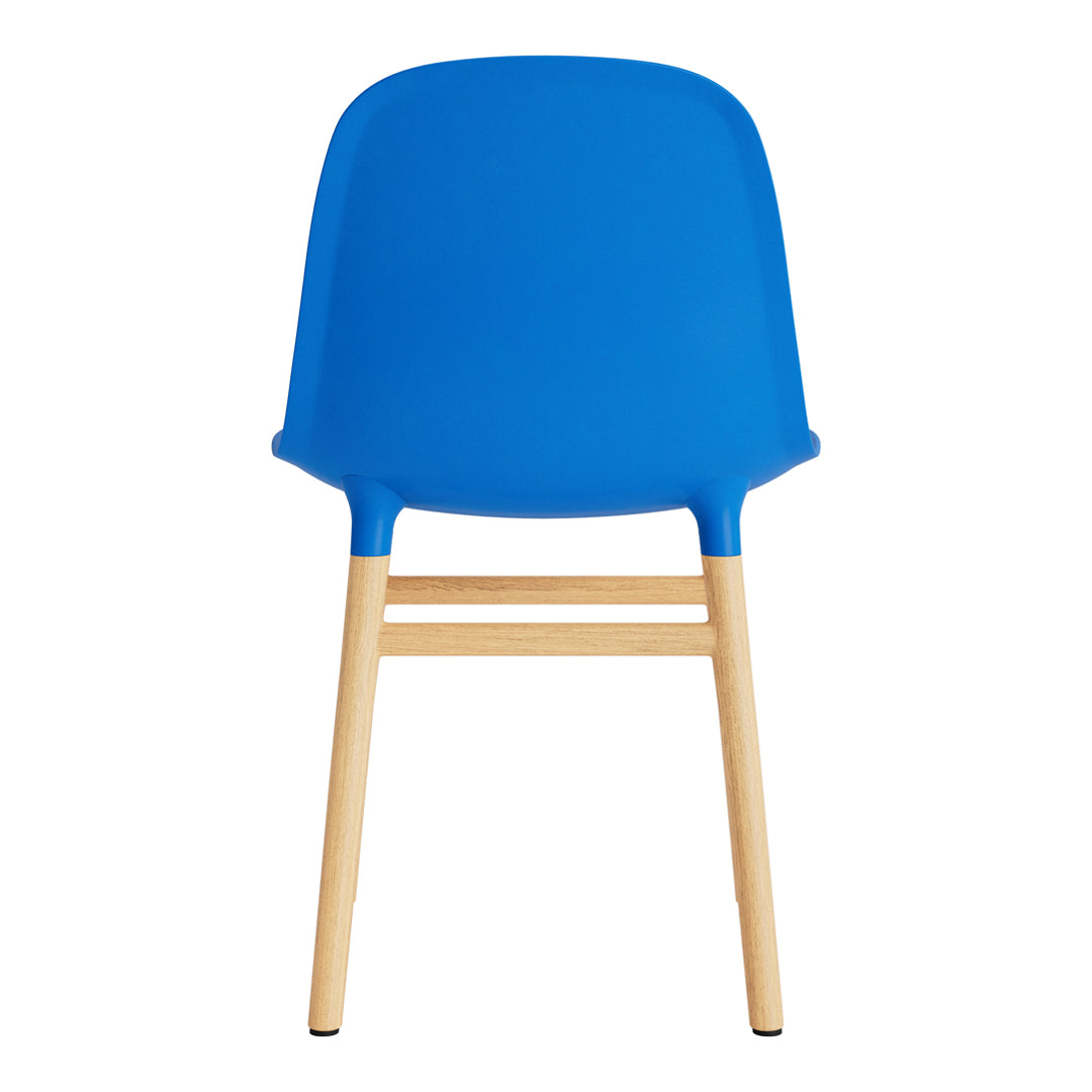 Bright blue plastic chair with natural wood legs, featuring a smooth, minimalist design. Perfect for modern decor.