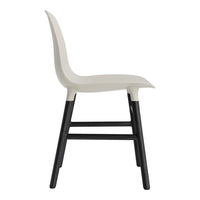 Light gray chair with a sleek design and black legs, featuring a smooth, minimalist finish. Ideal for modern decor.