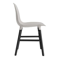 Stylish gray chair with a smooth finish and contrasting black legs, perfect for modern decor.