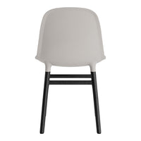 Gray chair with a sleek design and contrast black legs, perfect for modern decor.