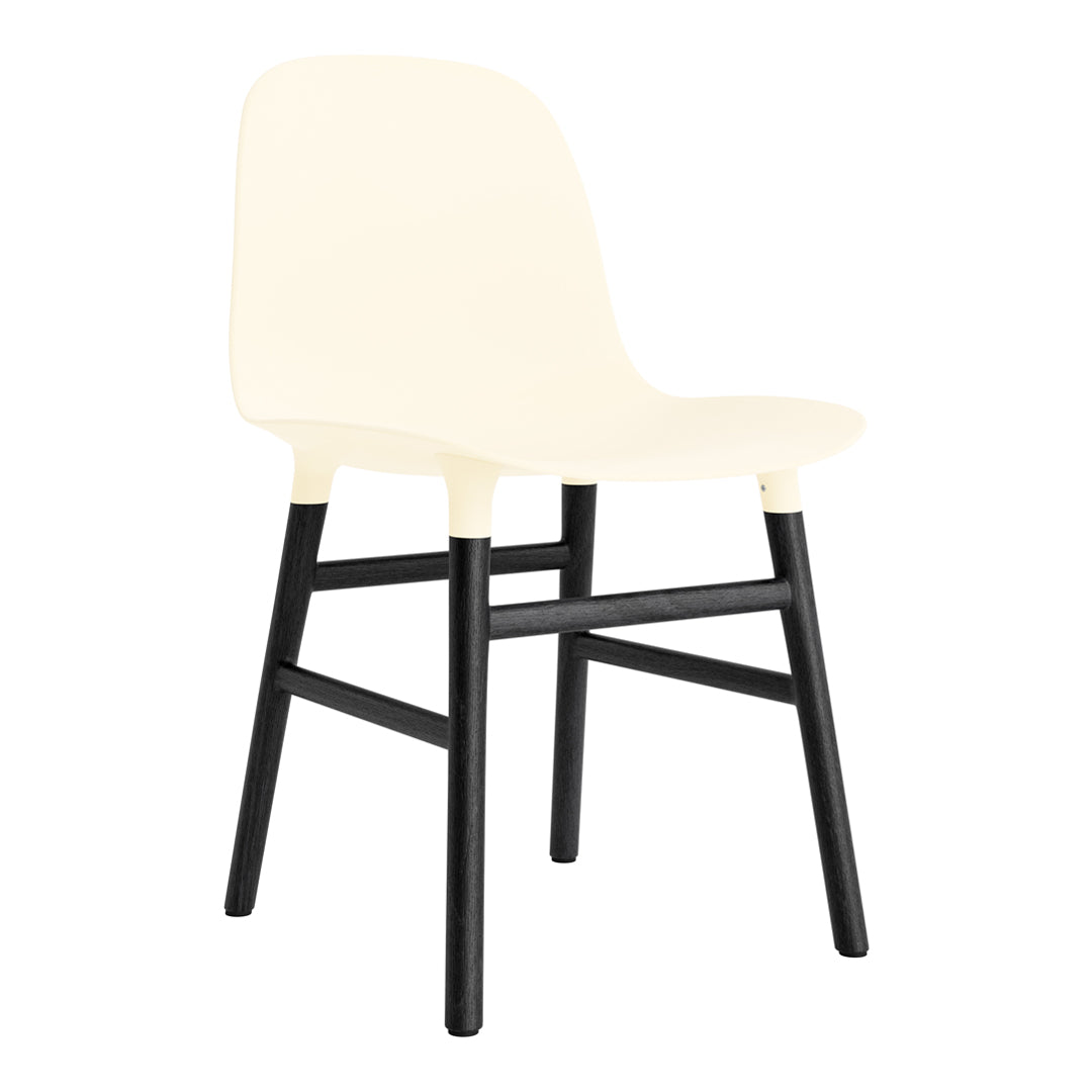 Cream-colored chair with a sleek, minimalist design and contrasting black wooden legs. Perfect for modern decor.