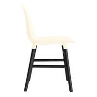 Stylish cream chair with a smooth surface and black wooden legs, perfect for modern decor.