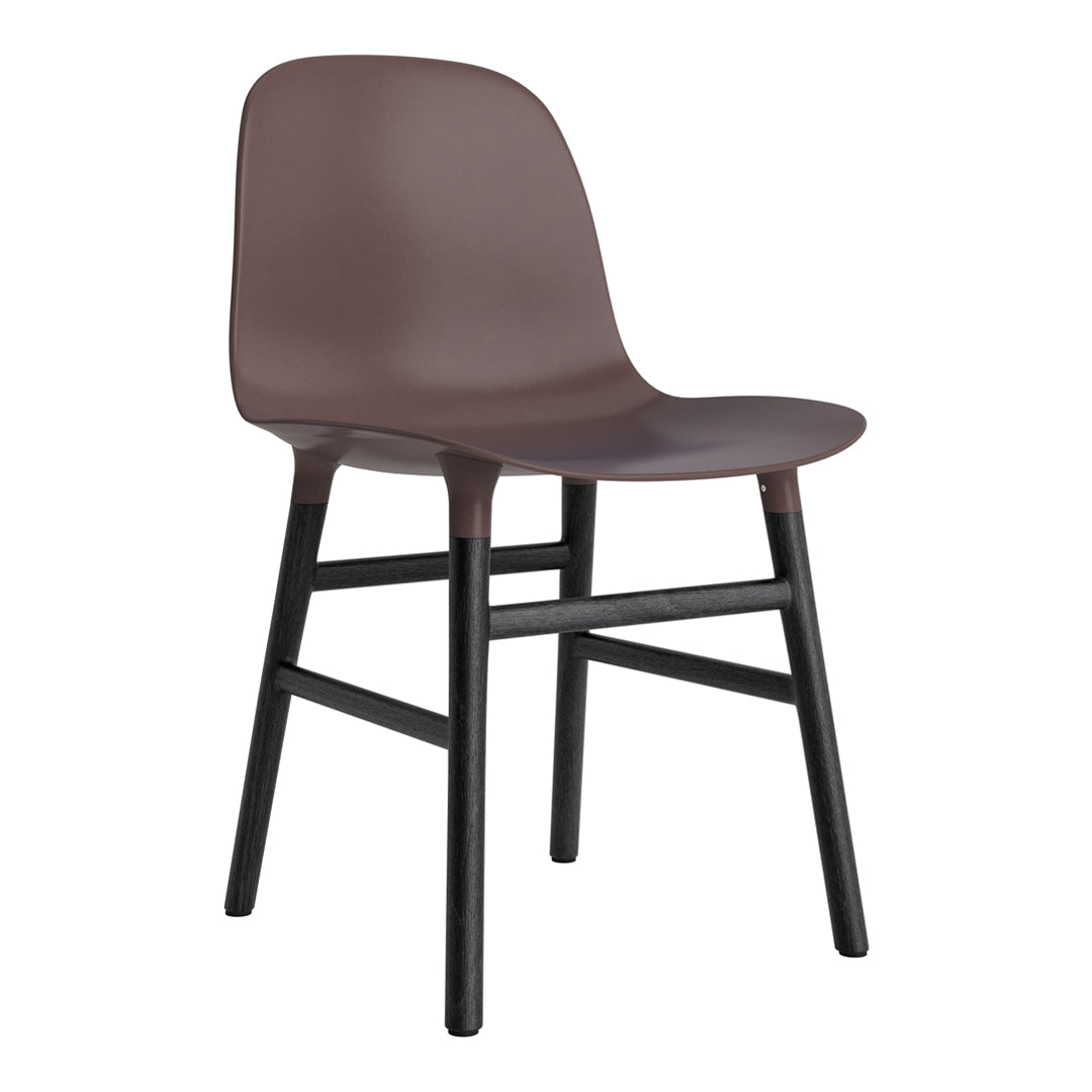 Brown plastic chair with a sleek design and black wooden legs, perfect for modern decor.