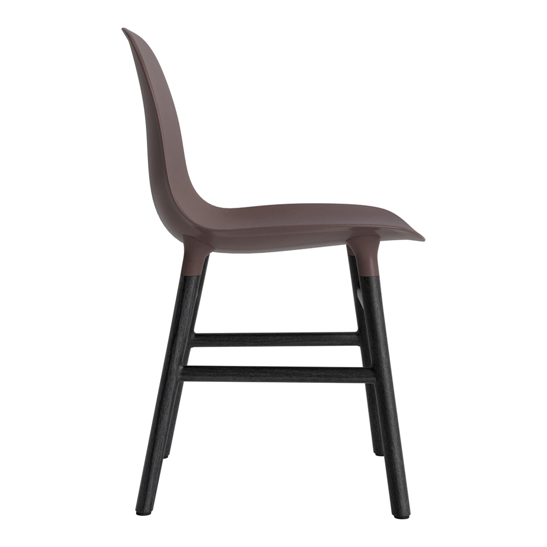 Side view of a sleek brown chair with a smooth finish and black wooden legs, featuring a minimalist design.