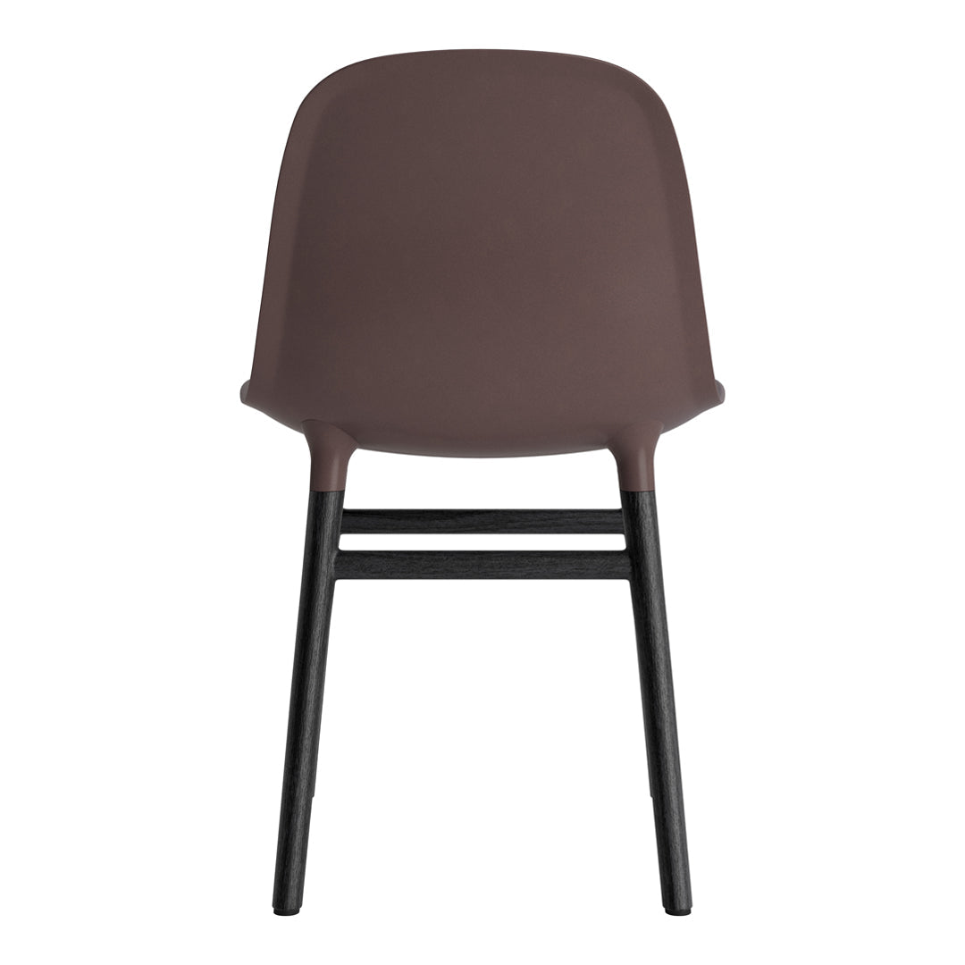 Brown plastic chair with a smooth finish and black wooden legs, offering a modern and minimalistic design.
