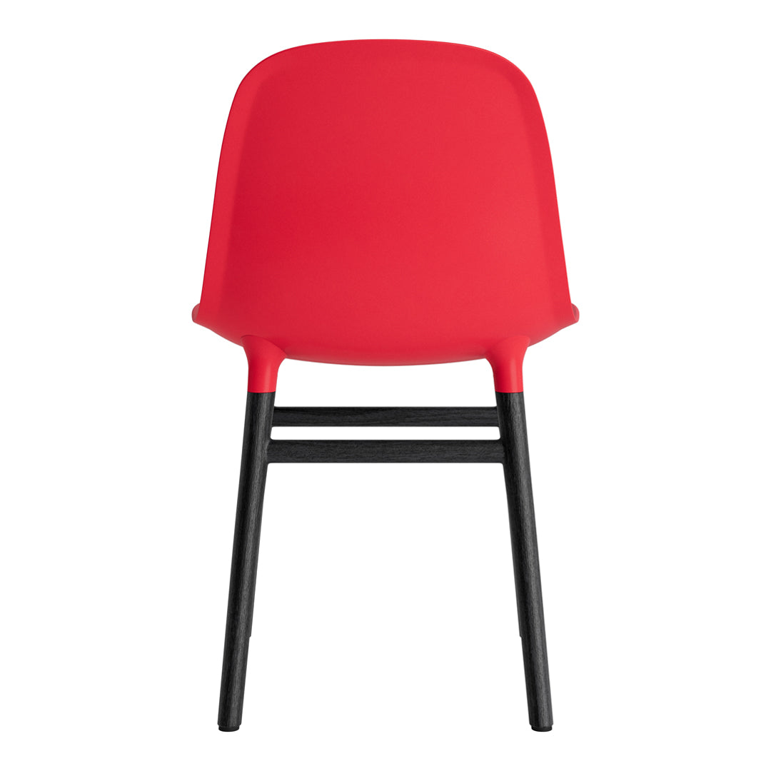 Red chair with a smooth finish and contrasting black legs, showcasing a modern and minimalist design.