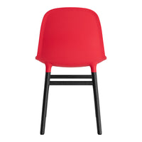 Red chair with a smooth finish and contrasting black legs, showcasing a modern and minimalist design.