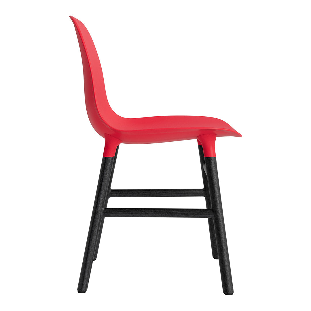 Red plastic chair with a sleek design, featuring a solid black wooden frame for contrast and durability.