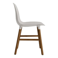 White chair with a smooth, minimalist design and natural wood legs. Simple, modern aesthetic.