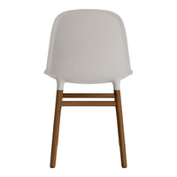 Minimalist white chair with smooth finish and natural wood legs, perfect for modern decor.