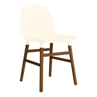 Cream-colored chair with a smooth finish and contrasting dark wooden legs, featuring a minimalist design.