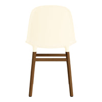 Cream chair with a smooth, matte finish and dark brown wooden legs in a modern, minimalist design.