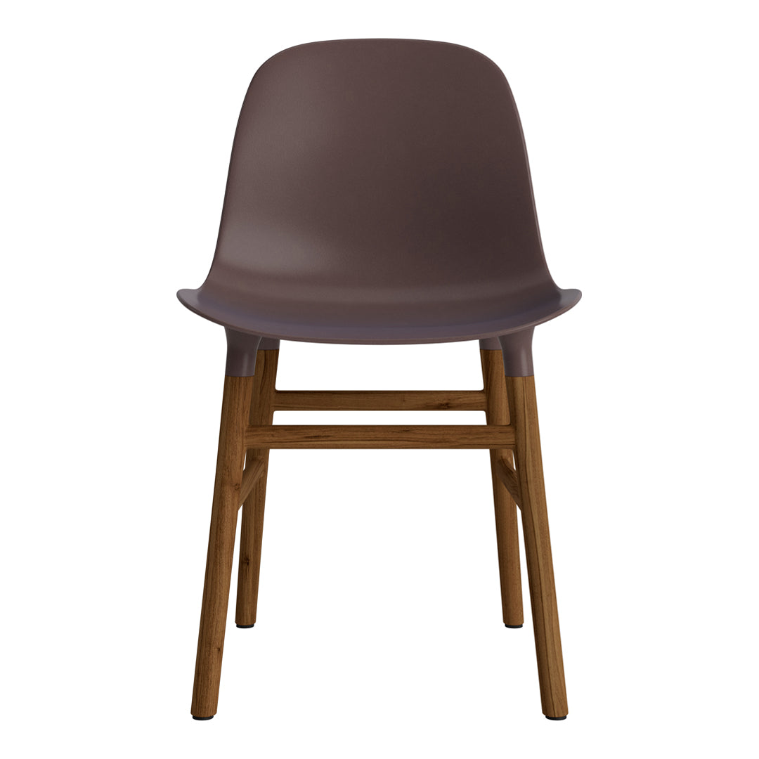 Modern brown plastic chair with a sleek design and wooden legs, featuring a smooth finish and minimalistic style.